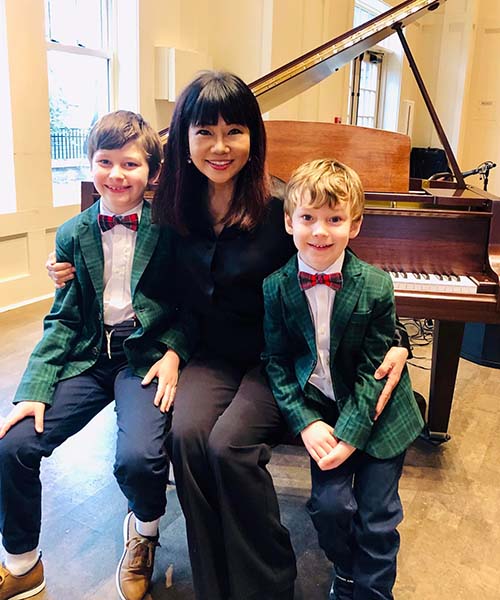 Juliana Johnson with students after piano recital